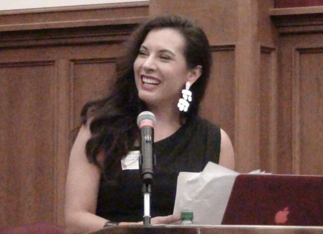 Gena Timberman, Founder Luksi Group, LLC at the Podium